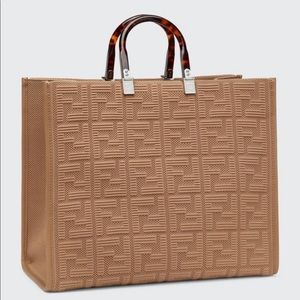 Brand new Tan Fendi Tote with Tags. Comes with a strap.